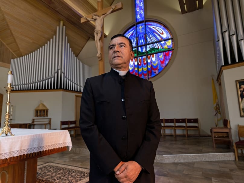 Father José Duvan Gonzalez, parochial vicar of St. Catherine of Siena Church in Kennesaw, is photographed in the sanctuary following Mass on Oct 5. Father Duvan said serving the Hispanic community challenges him daily to live faithfulness to the priesthood because of their love and devotion to God. Photo by Johnathon Kelso