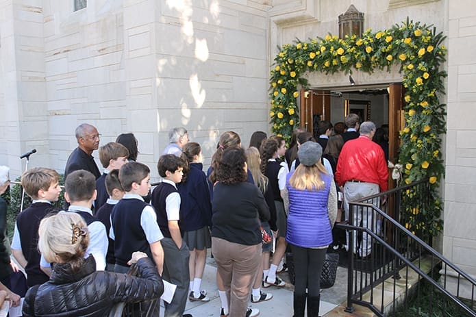 Once the doors were officially opened, people filed through the Holy Door into the cathedral. The start of the Extraordinary Holy Year of Mercy symbolically began with the opening of the first Holy Door at the Cathedral of Christ the King. Atlanta Photo By Michael Alexander