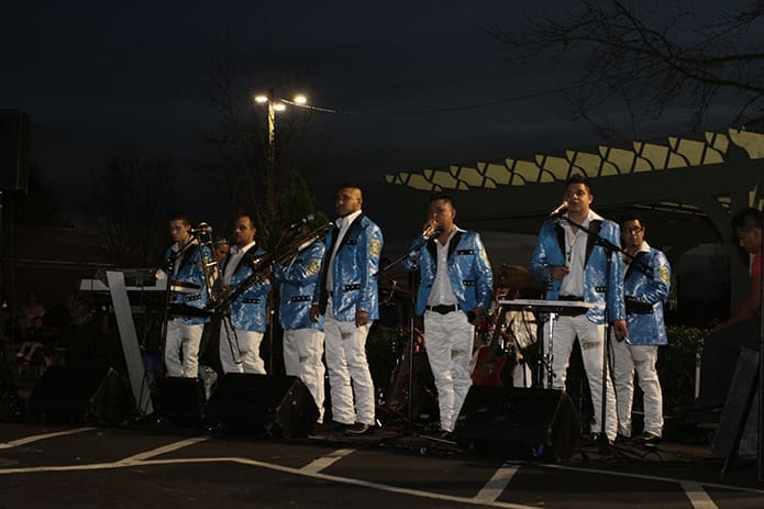 The Zentellos de Tierra Caliente Mariachi Band performs under the night sky during the Our Lady of Guadalupe celebration at Our Lady of the Americas Mission, Lilburn. Photo By Michael Alexander