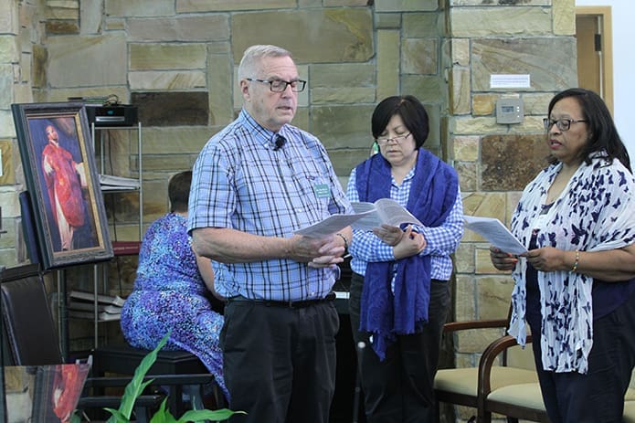 Jesuit Father Peter Fink, foreground, leads a day of prayer and reflection at Ignatius House Jesuit Retreat Center, Atlanta, July 31, the feast day of St. Ignatius of Loyola, the Spanish priest and founder of the Society of Jesus (Jesuits). Participating in the background are (r-l) Evette Oates of Our Lady of Lourdes Church, Atlanta, and Reina Pantaleon of the Cathedral of Christ the King, Atlanta. Photo By Michael Alexander