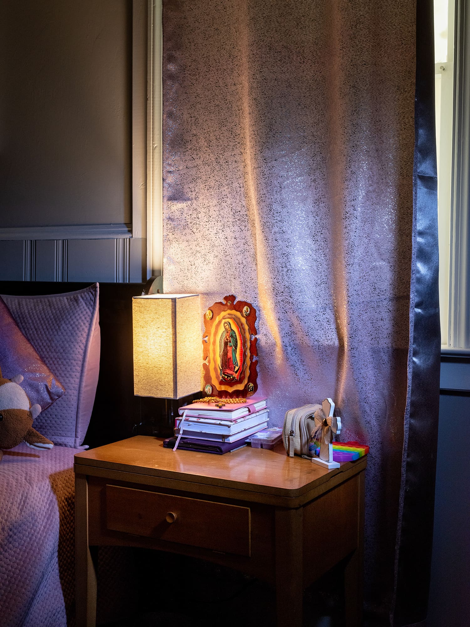An icon of Our Lady of Guadalupe and a rosary sit on Brenda's nightside table at her home in Tucker. Photo by Johnathon Kelso