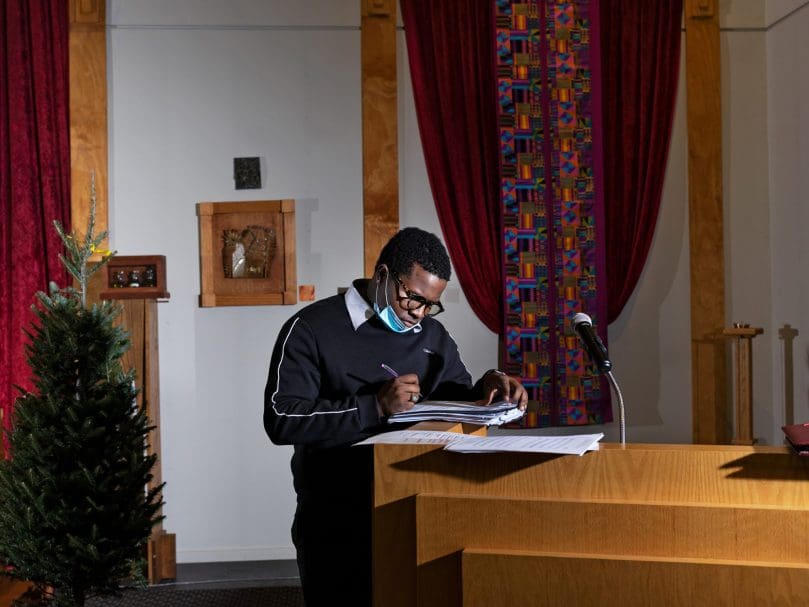 Thea Bowman Scholar Keron Campbell prepares for rehearsal the evening before  Lessons and Carols at Lyke House. Photographer, Johnathon Kelso