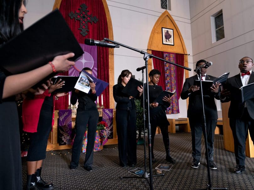 The Thea Bowman Scholars perform a song during the Lessons &amp; Carols event hosted at the Lyke House. Photographer, Johnathon Kelso