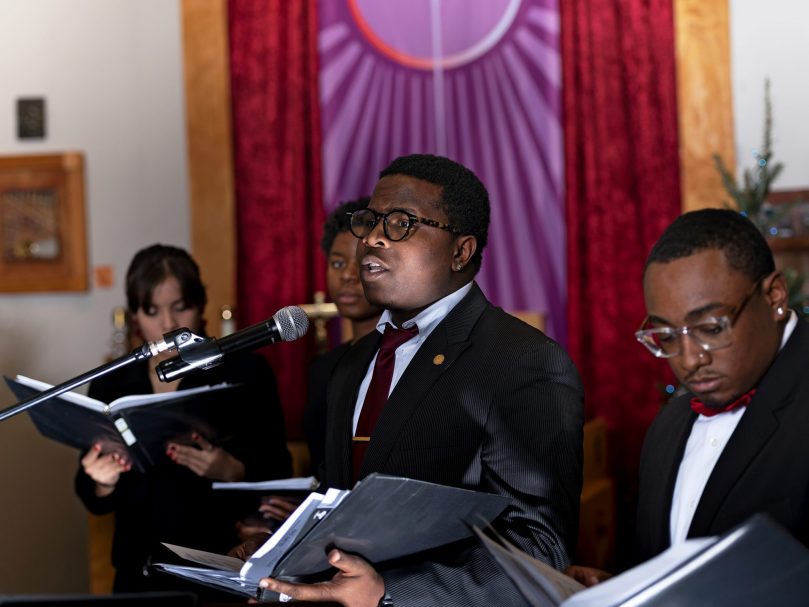 Thea Bowman Scholar Keron Campbell, center, performs during the Lessons & Carols event hosted at the The Lyke House. Photographer,Johnathon Kelso