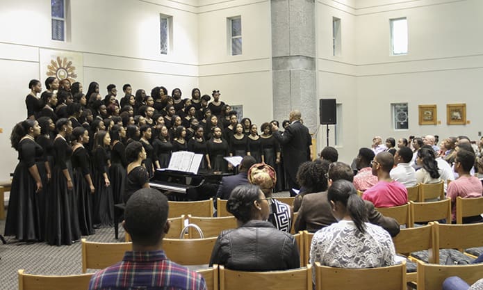 The Spelman College Glee Club, under the direction of Dr. Kevin Phillip Johnson, performs during an Oct. 15 concert as part of the 25th anniversary festivities at Lyke House, the Catholic Center at the Atlanta University Center. Photo By Michael Alexander