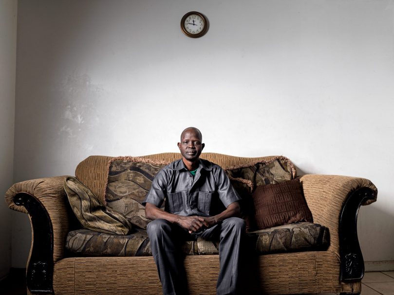 Majok Marier escaped the war in South Sudan in 1987 and founded Wells for Hope to construct drinking wells for villages there. He spoke at “I Thirst,” a Feb. 26 program ahead of the Lenten season at St. Philip Benizi Church, Jonesboro. Marier is photographed at his home in Clarkston. Photo by Johnathon Kelso