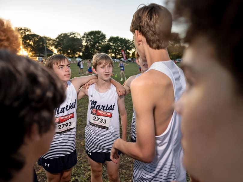 Marist junior varsity runners Bryson Seebach, left, and Finn Botham photographed before their first race of the evening at the Wingfoot XC Classic in Cartersville. Photo by Johnathon Kelso