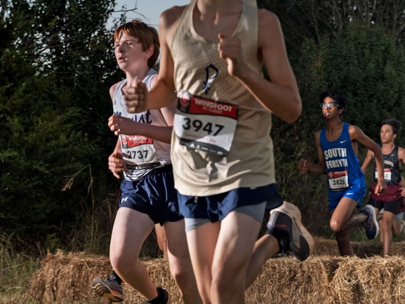 Marist runner Campbell Caldwell, left, competes against other athletes during the Wingfoot XC Classic held in Cartersville. Photo by Johnathon Kelso