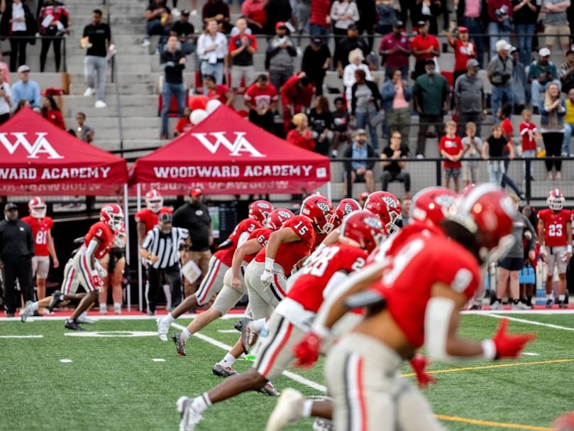 The Woodward Academy War Eagles run the field after the opening kickoff against  visiting Marist School on Sept. 9 Photo by Johnathon Kelso