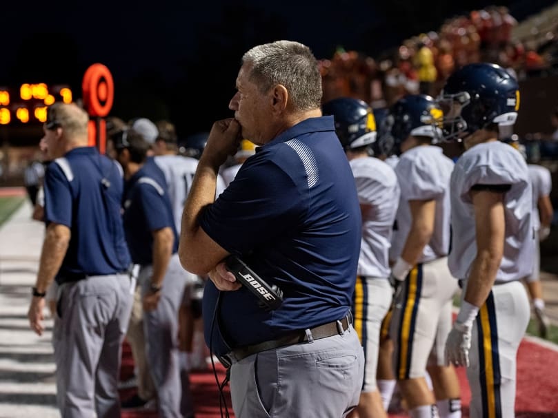 Marist Assistant Coach Gary Miller looks on during the end of the game against Woodward Academy on Sept. 9. Photo by Johnathon Kelso