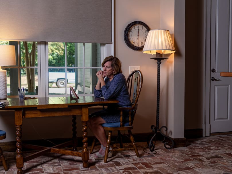 Betsy Orr sits in contemplation before an icon of the Madonna and child at her home in Washington. Photo by Johnathon Kelso