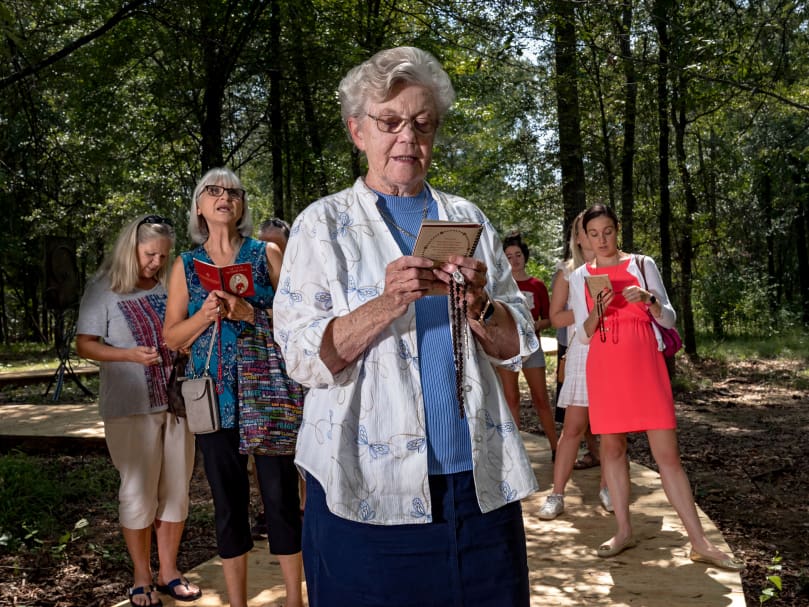Delores Ferguson and others pray the Seven Sorrows of Mary at Heritage Preserve on Sept. 11. Photo by Johnathon Kelso