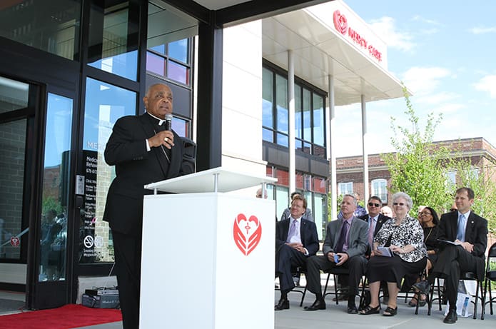 During the May 1 dedication of the Mercy Care Chamblee Clinic, Archbishop Wilton D. Gregory gives some brief remarks before he leads the crowd on hand in a moment of reflection. Photo By Michael Alexander