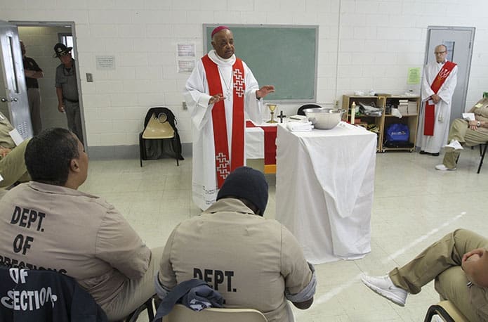 Archbishop Wilton D. Gregory addresses a small congregation of some 25 inmates during his homily at the Arrendale State Prison in Alto. Photo By Michael Alexander