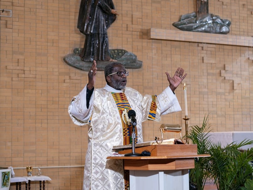 Deacon Lennison “Lenny” Alexander, of Our Lady of Lourdes Church, reads the responsorial psalm during the annual MLK Mass. Photo by Johnathon Kelso