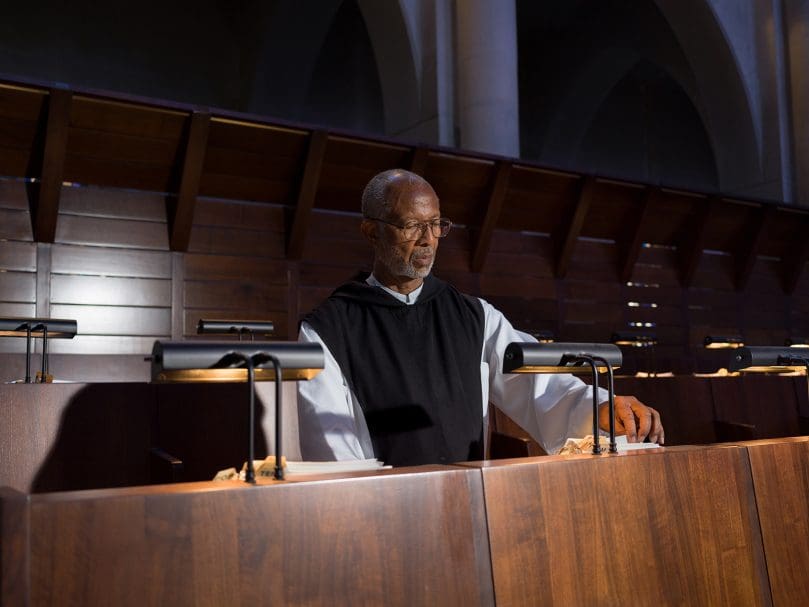 Brother Callistus Crichlow, OCSO, prepares for vespers inside the sanctuary of the Abbey Church at the Monastery of the Holy Spirit in Conyers. Photo by Johnathon Kelso