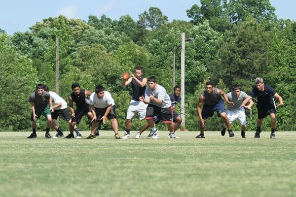An hour and a half before the team’s first ever scrimmage against Augusta Prep, the offensive players run some plays during a May 23 practice. Photo By Michael Alexander