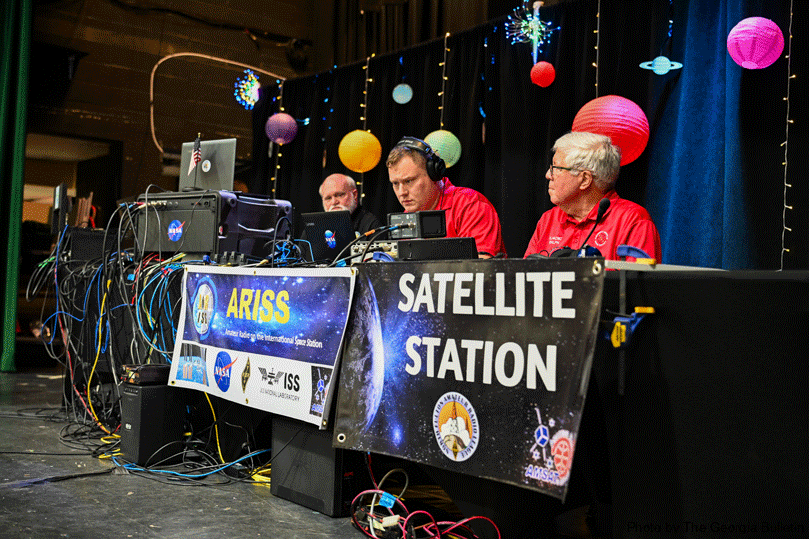 From left, Daryl Young, Pinecrest’s ARISS mentor; Kevin Ball and Ralph Pickwick work with radios and equipment to make sure everything goes smoothly as Pinecrest Academy students contact the International Space Station. ARISS enables students worldwide to experience the excitement of talking directly with crew members on the space station, inspiring them to pursue careers in science, technology and engineering. Photo by Julianna Leopold