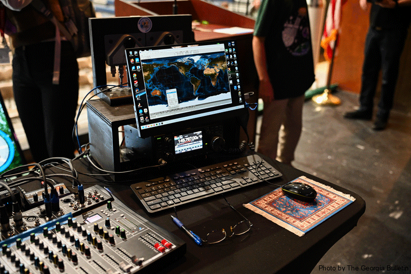 A monitor with a picture of the earth on screen sits next to radio equipment during Pinecrest Academy's school assembly organized to contact NASA astronaut Col. Mike Fincke aboard the International Space Station. Amateur Radio organizations, and space agencies in the USA, Russia, Canada, Japan and Europe sponsor this educational opportunity by providing equipment and operational support to enable direct communication between crew on the ISS and students. Photo by Julianna Leopold