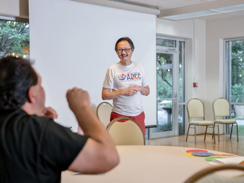 Peter Un listens during the 2022 National Deaf Cursillo at Ignatius House Jesuit Retreat Center in Sandy Springs. It was the first gathering for the Deaf Catholic community since the pandemic. Photo by Johnathon Kelso