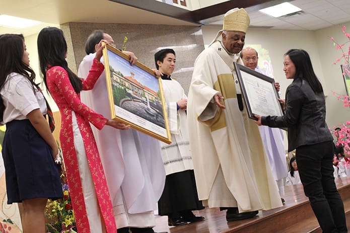 Anh Thu Pham, right, was one of several benefactors recognized by Our Lady of Vietnam Church for their generosity and support. Photo By Michael Alexander