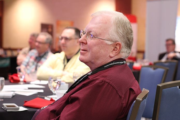 Msgr. Patrick Garrity of Knoxville, Tenn., listens to Atlanta Archbishop Wilton D. Gregory deliver his talk during a plenary session of the National Federation of Priestsâ Councilsâ annual convocation. Photo By Michael Alexander