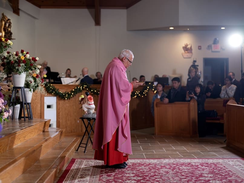 Cardinal Álvaro Leonel Ramazzini Imeri, Bishop of Huehuetenango, prepares to give holy Communion to the faithful during a Mass  at St. Oliver Plunkett Church in Snellville. The community held-a two-day celebration of the Feast of Our Lady of Guadalupe the same weekend.