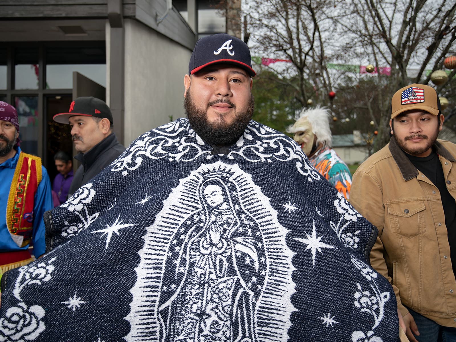 A parishioner wears a sarape depicting Our Lady of Guadalupe during a two-day celebration held at St. Oliver Plunkett Church. Photo by Johnathon Kelso