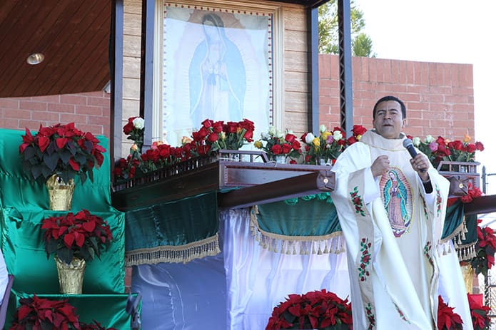 Father Jose Duvan Gonzalez, parochial vicar at St. Joseph Church, Dalton, delivers an energetic and impassioned sermon about the community’s devotedness to Our Lady of Guadalupe. Photo By Michael Alexander