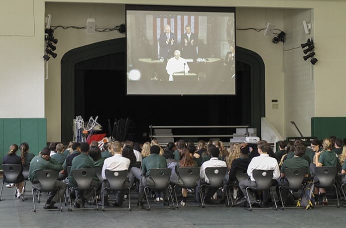 High school students in the Holy Spirit Preparatory School gymnasium, Atlanta, watch vice president Joe Biden and speaker of the House John Boehner stand and applaud Pope Francis at the conclusion of his address before the joint session of the United States Congress. Photo By Michael Alexander