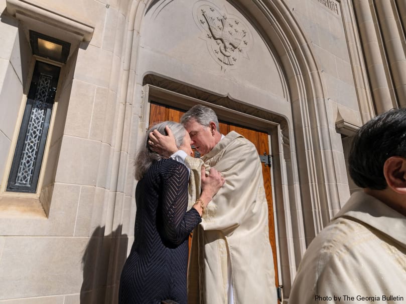 Deacon Samuel Fraundorf blesses his wife Mary Ann following the Mass of ordination to the permanent diaconate Feb. 3 at the Cathedral of Christ the King. Photo by Johnathon Kelso