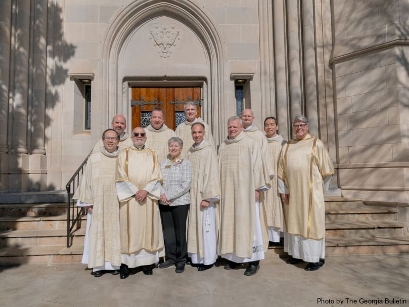 The eight candidates for the permanent diaconate pose with Deacon José Espinosa, co-director of diaconate formation, second from left; Penny Simmons co-director of diaconate formation, and Deacon Dennis Dorner Sr., chancellor and director of the permanent diaconate, right front, following the the Mass of ordination Feb. 3 at the Cathedral of Christ the King. Photo by Johnathon Kelso