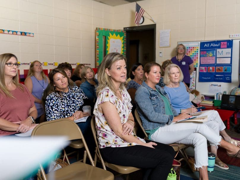 Anna Loyd, director of Good Shepherd Preschool, center, and other teachers and administrators listen during one of the sessions of the Preschool Summer Institute at Holy Family Church in Marietta. Photo by Johnathon Kelso