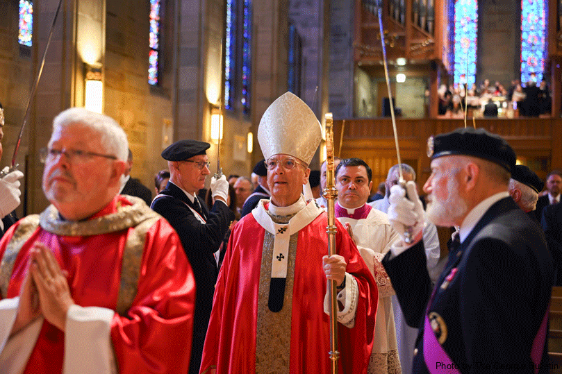 Archbishop Gregory J. Hartmayer, OFM Conv., walks toward the altar at the annual Red Mass at the Cathedral of Christ the King in Atlanta.  Photo by Julianna Leopold