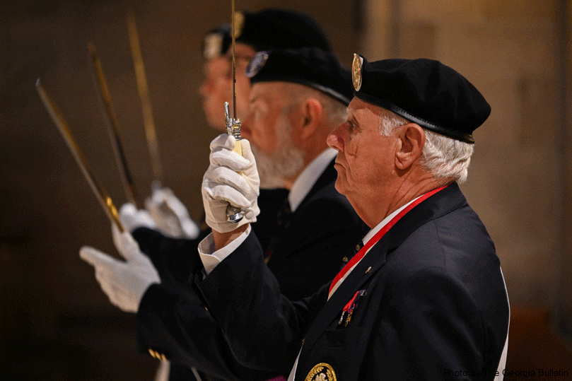 Sir Knight Bob DuPree and other members of the Knights of Columbus Assembly #3313 unsheathe their swords at the Cathedral of Christ the King during the annual Red Mass. Photo by Julianna Leopold