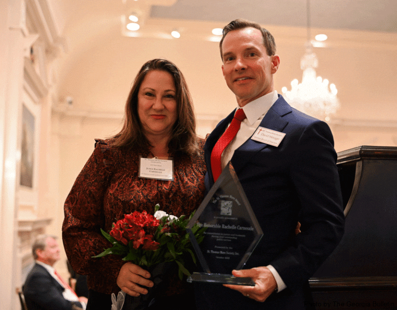 David J. Metzger presents Judge Rachelle Carnesale with the St. Thomas More award for her work with the My Journey Matters Program. This program is an alternative to long term incarceration for young offenders facing significant mandatory sentences. The focus of the program remains on education, training and reform.  Photo by Julianna Leopold