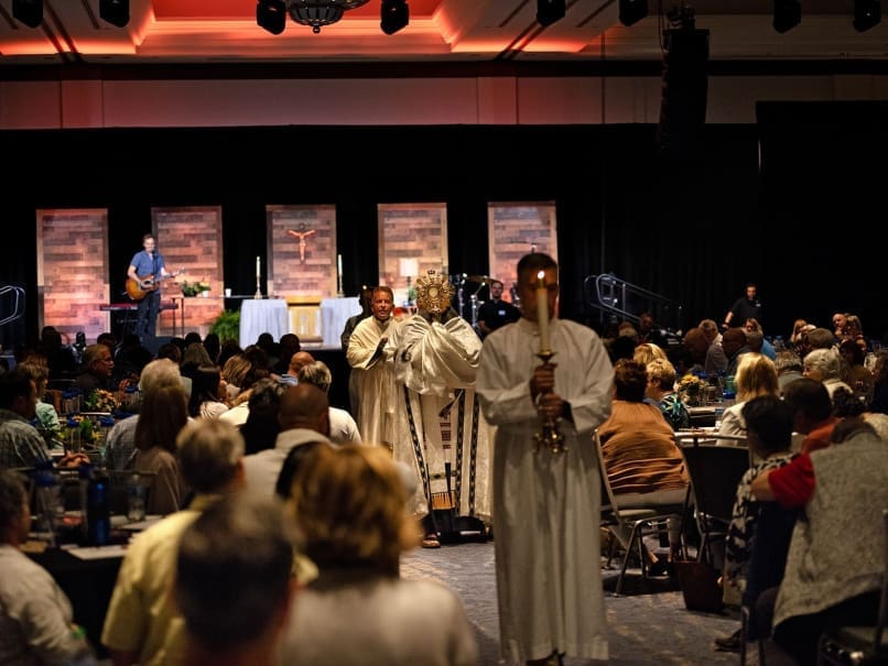 Archbishop Gregory J. Hartmayer, OFM Conv., processes with the Blessed Sacrament during Rescue Atlanta at Cobb Galleria Centre. Photo by Johnathon Kelso