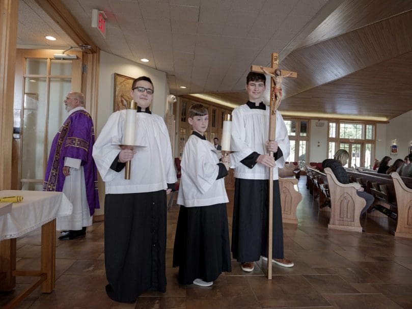 Altar servers prepare for the procdession at the Rite of Election March 5. Photo by Johnathon Kelso