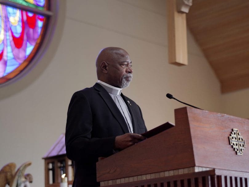 Deacon Al Turner of St. John Vianney Church in Lithia Springs reads the names of catechumens during the March 5 Rite of Election at St. Catherine of Siena Church in Kennesaw. Bishop Joel M. Konzen, SM, led the rite.  Photo by Johnathon Kelso