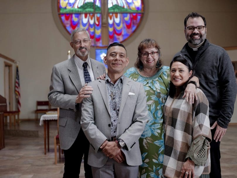 Candidate Jorge Miguel Mejia of St. Vianney Church stands with his friends and family following the March 5 Rite of Election. From Left to right, Godfather Deacon Felix J. Rentas, Jorge Miguel Mejia, Godmother Frances T. Rentas, wife Araceli Hernandes, and Father Jack Knight. Photo by Johnathon Kelso