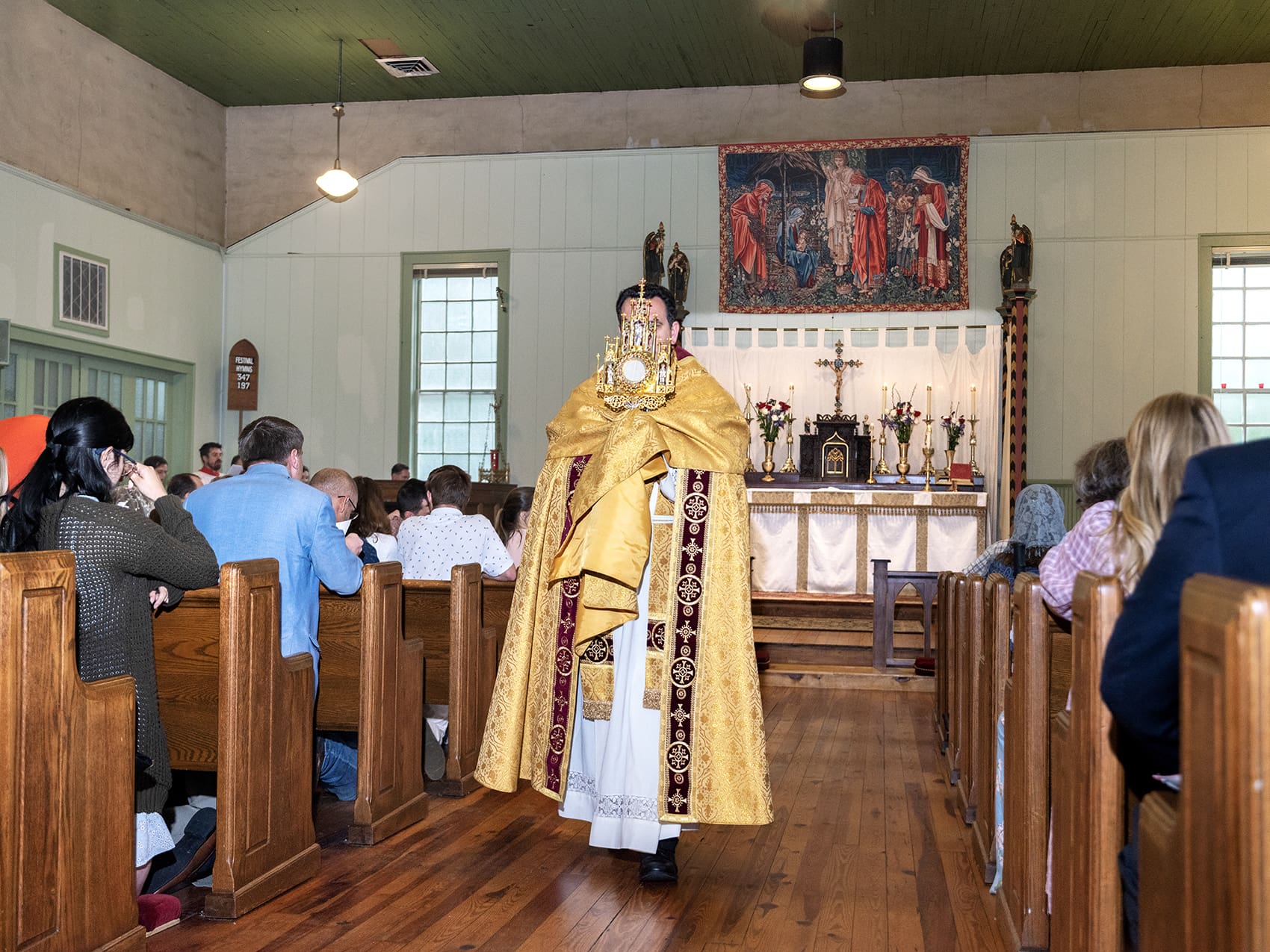 Bishop Steven J. Lopes of the Ordinariate of the Chair of Saint Peter, processes with the Blessed Sacrament during the Feast of Corpus Christi at Saint Aelred Church in Bishop. Photo by Johnathon Kelso