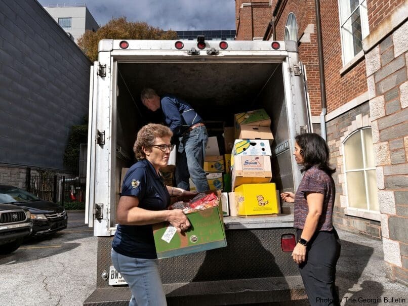 Volunteers help unload food donated by Second Helpings Atlanta at the Shrine of the Immaculate Conception. The parish marks 175 years in 2023. Photo by Johnathon Kelso
