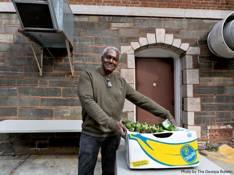 Groundskeeper Carl Hall helps unload food donations at the Shrine of the Immaculate Conception in Atlanta. The church is celebrating 175 years. Photo by Johnathon Kelso