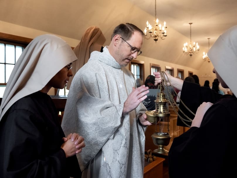 Father Tim Gallagher, pastor of St. Bernadette Church, Cedartown, prepares to hold a Mass in honor of St. Michael the Archangel on Michaelmas with the Sisters Poor of Jesus Christ and members of the community at Fraternitas St. Katherine Drexel, the original church building of St. Bernadette.