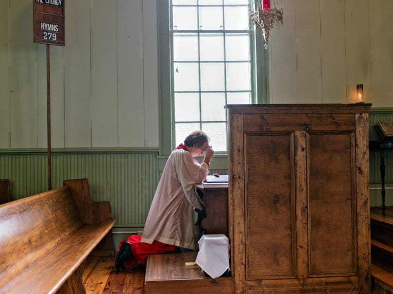Cantor Hank Sullivant of St. Aelred Church prays before Mass on the Solemnity of Saint Joseph. Photo by Johnathon Kelso
