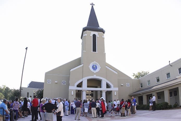 Parishioners gather on the plaza in front of St. Andrew Church, Roswell for the Aug. 27 liturgical celebration marking the blessing of the recently renovated church. Photo By Michael Alexander
