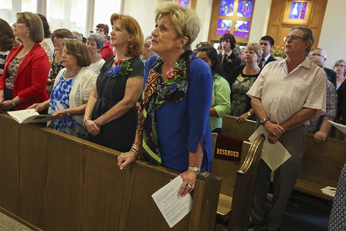 (Front pew, r-l) Parish council member Renay Miller, dedication committee members Margaret Ward and Martita Macías and transition committee member Mary McEwen are on hand for Aug. 27 Mass. Photo By Michael Alexander