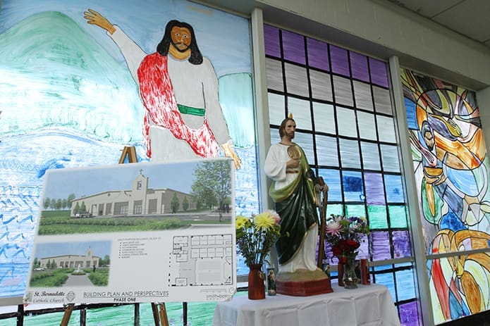 The entrance to the existing place of worship for the Hispanic community displays an architectural drawing of the proposed St. Bernadette Church in Cedartown. Photo By Michael Alexander