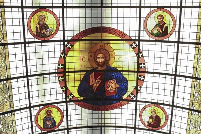 The new main icon appearing on the refurbished vaulted glass skylight is known as the Pantocrator, an image of Christ the All Powerful. It is surrounded by the Four Evangelists, (clockwise, from top left) Saints Matthew, Mark, John and Luke. Christ Pantocrator serves as a reminder that Christ is the head of the Church and he presides over every liturgy. Photo By Michael Alexander
