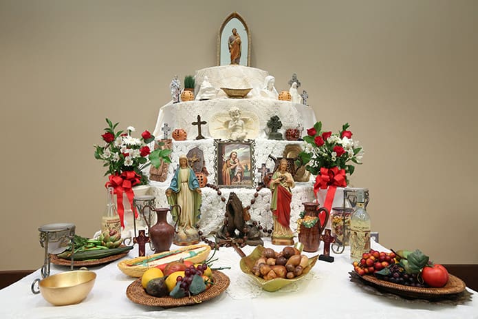 The St. Joseph Altar was front and center at St. Peter Chanel Church, Roswell, during its 13th annual St. Joseph’s Feast, March 16. Following a 6 p.m. Mass, parishioners were treated to a meal that included caprese or Caesar salad, pasta fagioli, shrimp and pasta marinara, penne pasta with light marinara, orange slices and Italian cookies. John Damiano heads up the 10-member St. Joseph Feast committee. Photo By Michael Alexander